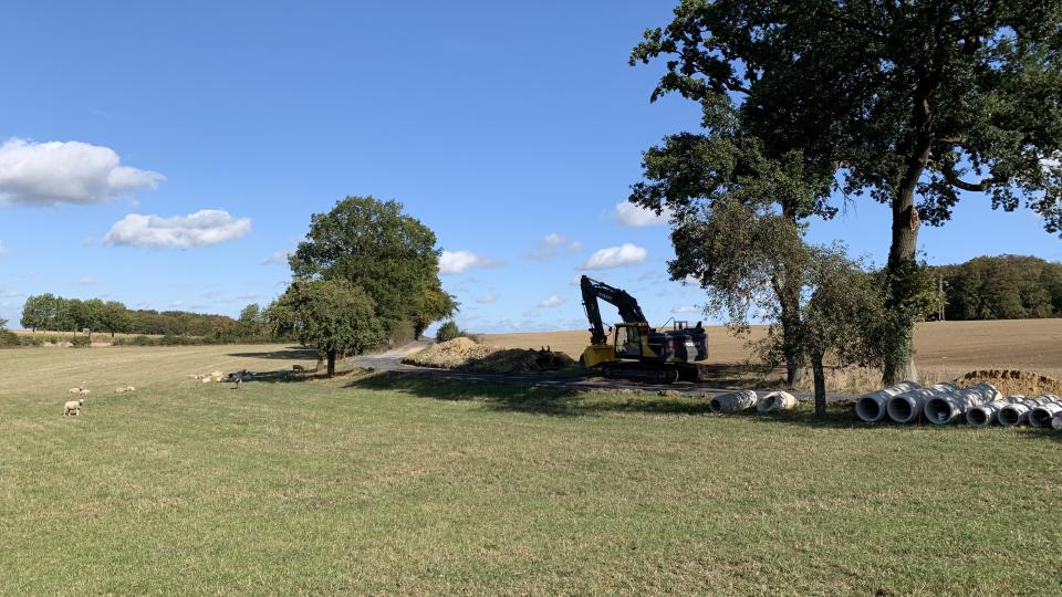 Landschaft mit Bagger